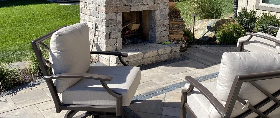 Chairs by an outdoor fireplace in Lenexa, KS.