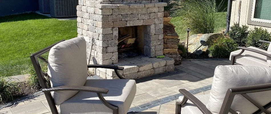 Chairs in front of an outdoor fireplace in Gardner, KS.