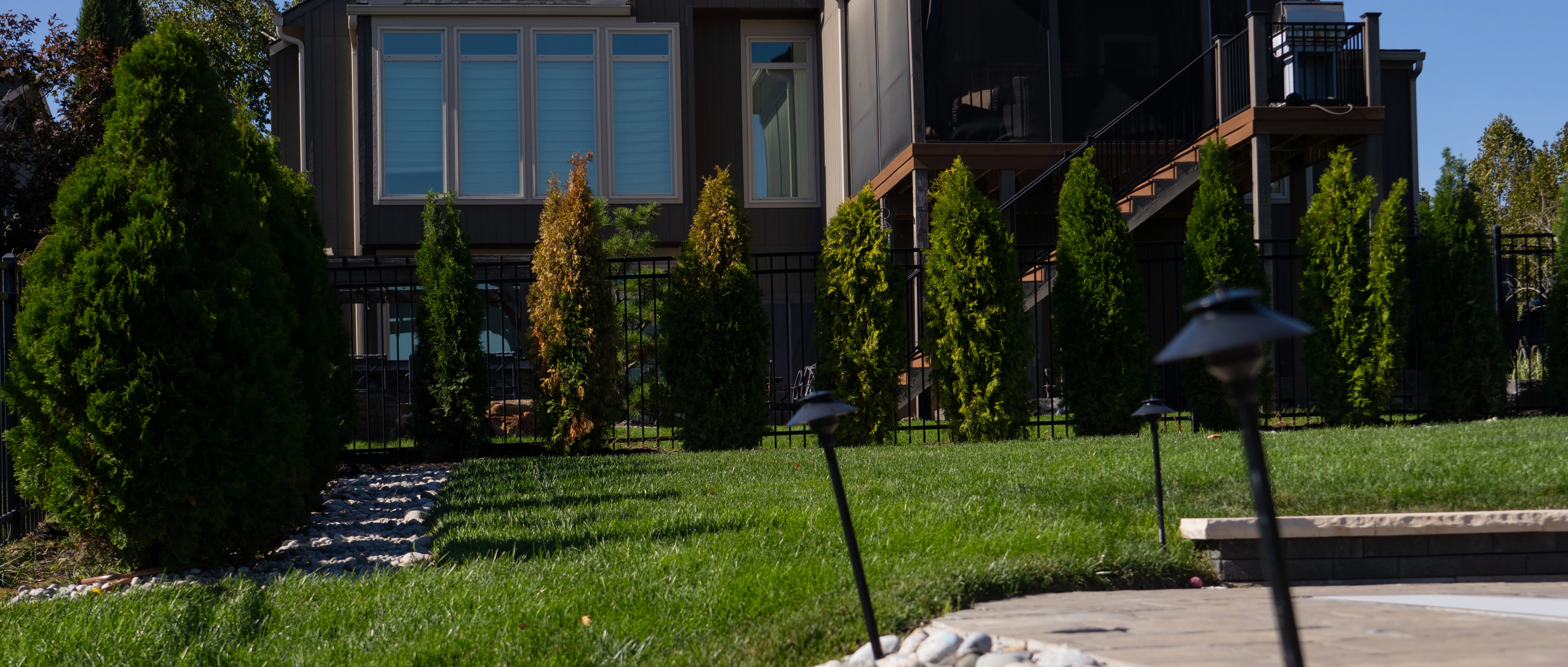 Landscaping along the side of a home in Olathe, KS.