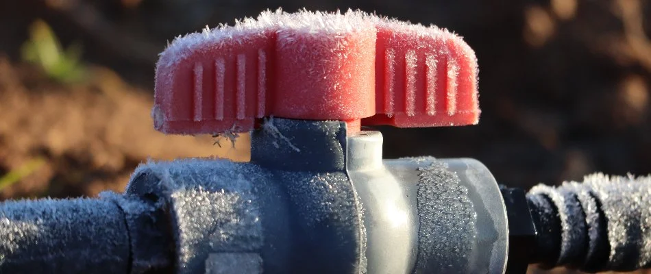 Irrigation handle with frost on a property in Olathe, KS.